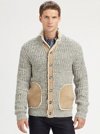 An innovative design that exudes luxury and warmth, knitted from Shetland wool with leather accents along the placket, pockets and elbow patches for a definitive look.Button-frontStand collarWoolDry cleanImported An innovative design that exudes luxury and warmth, knitted from Shetland wool with leather accents along the placket, pockets and elbow patches for a definitive look.Button-frontStand collarWoolDry cleanImported