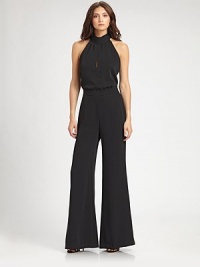 This chic one-piece style transitions flawlessly from day to night.Halter neckline with back tieSleevelessFront keyhole detailBanded waistWide legLow V back with concealed zipFully linedAbout 17 from shoulder to waistInseam, about 34PolyesterDry cleanMade in USA of imported fabricModel shown is 5'11 (180) wearing US size 4. This chic one-piece style transitions flawlessly from day to night.Halter neckline with back tieSleevelessFront keyhole detailBanded waistWide legLow V back with concealed zipFully linedAbout 17 from shoulder to waistInseam, about 34PolyesterDry cleanMade in USA of imported fabricModel shown is 5'11 (180) wearing US size 4.