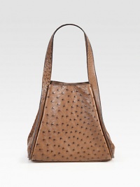 Luxurious ostrich crafted in a roomy carryall.Shoulder straps, 7¾ dropMagnetic snap closure and gussetsProtective metal feetOne inside open pocket12½W X 9¼H X 6¼DImported Luxurious ostrich crafted in a roomy carryall.Shoulder straps, 7¾ dropMagnetic snap closure and gussetsProtective metal feetOne inside open pocket12½W X 9¼H X 6¼DImported