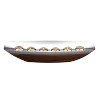 Willowy and compelling, the sloop-shaped centerpiece tealight appears to have been carved from the Amazon tree of the same name. Indeed, the rectangular alloy rim practically floats on its curved acacia wood hull, as the light from the 6 tea lights reflects glimmering light. Todd Myers captured the sprit of the Marupa collection in this stunning centerpiece that will enhance a rustic credenza or a fine dining table as a work of art. Willowy and compelling, the sloop-shaped centerpiece tealight appears to have been carved from the Amazon tree of the same name. Indeed, the rectangular alloy rim practically floats on its curved acacia wood hull, as the light from the 6 tea lights reflects glimmering light. Todd Myers captured the sprit of the Marupa collection in this stunning centerpiece that will enhance a rustic credenza or a fine dining table as a work of art.