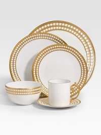 A beautiful saucer in fine Limoges porcelain, made entirely by hand and finished with individually-applied 14k gold along the pearl border. From the Perlee Gold Collection Porcelain 6½ diam. Dishwasher safe Imported 