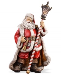 Rose-cheeked and with a joyful smile upon his face, Santa creates a festive holiday mood dressed in his traditional attire and holding a lantern. Rose-cheeked and with a joyful smile upon his face, Santa creates a festive holiday mood dressed in his traditional attire and holding a lantern.