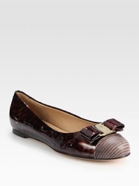 Luminous patent leather flat fronted by a logoed bow and exotic, textured leather toecap. Patent leather and printed leather upperLeather lining and solePadded insoleMade in Italy Luminous patent leather flat fronted by a logoed bow and exotic, textured leather toecap. Patent leather and printed leather upperLeather lining and solePadded insoleMade in Italy