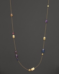 Stations of amethyst and topaz mix with hand-engraved 18K yellow gold in this statement necklace from Marco Bicego. Stations of amethyst and topaz mix with hand-engraved 18K yellow gold in this statement necklace from Marco Bicego.