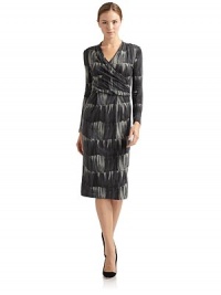 THE LOOKAbstract graphic patternSurplice v-neckDraped detailing at bodice Long sleevesPleated skirtBack zipper with hook-and-eye closureTHE FITAbout 41 from shoulder to hemTHE MATERIALViscoseFully linedCARE & ORIGINDry cleanMade in ItalyModel shown is 5'9 (175cm) wearing US size 4. THE LOOKAbstract graphic patternSurplice v-neckDraped detailing at bodice Long sleevesPleated skirtBack zipper with hook-and-eye closureTHE FITAbout 41 from shoulder to hemTHE MATERIALViscoseFully linedCARE & ORIGINDry cleanMade in ItalyModel shown is 5'9 (175cm) wearing US size 4.