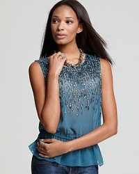 A drizzle of sequins and beads throughout the silhouette of this silk Joie top lend sparkling glamour to the holiday season. A drizzle of sequins and beads throughout the silhouette of this silk Joie top lend sparkling glamour to the holiday season.