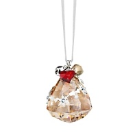 Sparkling Swarovski crystal in a warm golden hue is embellished with silvery metal details, dangling charms and a small jingling bell to create this festive Christmas ornament. Sparkling Swarovski crystal in a warm golden hue is embellished with silvery metal details, dangling charms and a small jingling bell to create this festive Christmas ornament.