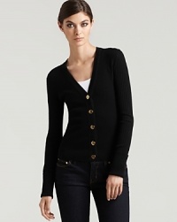 Update your wardrobe with the slim-cut silhouette of this classic cardigan, featuring Tory Burch logo embossed gold tone buttons. Update your wardrobe with the slim-cut silhouette of this classic cardigan, featuring Tory Burch logo embossed gold tone buttons.