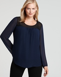 Gain instant style credo in this DKNYC Plus blouse touting chic color blocking and sheer detailing for modern femininity. Gain instant style credo in this DKNYC Plus blouse touting chic color blocking and sheer detailing for modern femininity.