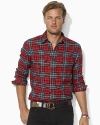 Putting a preppy twist on a conventionally rugged look, this relaxed-fitting plaid shirt is rendered in soft cotton with Ralph Lauren's embroidered pony adorning the chest.