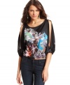 Cutout details up the sultry appeal on this BCBGMAXAZRIA printed blouse -- pair it with your fave denim!