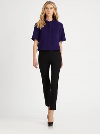 An edgy little design in a smooth double-faced wool blend with short sleeves, a cropped silhouette and separate knit long sleeves to wear when you want.Peter Pan collar An edgy little design in a smooth double-faced wool blend with short sleeves, a cropped silhouette and separate knit long sleeves to wear when you want.Peter Pan collar