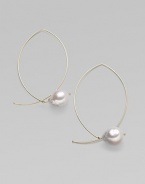 A delicate marquis shape, delineated in 14k gold wire, is capped by a lustrous pearl for a modern twist on a classic hoop. White freshwater baroque pearls 14k yellow gold Length, about 1¾ Width, about 1 Pierced Made in USA