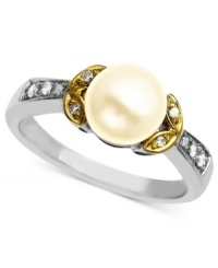 A solitary cultured freshwater pearl (7 mm) surrounded by diamond accents makes for a regal, eye-catching ring. Set in 14k gold and sterling silver. Size 7. A solitary cultured freshwater pearl (7 mm) surrounded by diamond accents makes for a regal, eye-catching ring. Set in 14k gold and sterling silver. Size 7.