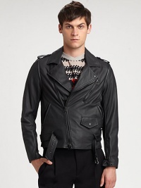 Made from butter-soft Italian leather, this edgy jacket offers style versatility, thanks to its detachable sleeves.Notched collarDetachable sleevesEpaulettesAsymmetrical zipper detailsChest and slash pocketsAbout 25 from shoulder to hemLambskinDry clean by leather specialistImported of Italian fabric