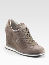 Suede sneakers with a silvertone logo, elevated by a covered wedge. Self-covered wedge, 3½ (90mm)Suede upperLeather liningRubber solePadded insoleImported Suede sneakers with a silvertone logo, elevated by a covered wedge. Self-covered wedge, 3½ (90mm)Suede upperLeather liningRubber solePadded insoleImported