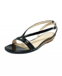 Summer feet deserve a shiny accessory. The Bev sandals by Calvin Klein feature sweeping patent leather straps atop a tiny, cork demi-wedge. Summer feet deserve a shiny accessory. The Bev sandals by Calvin Klein feature sweeping patent leather straps atop a tiny, cork demi-wedge.