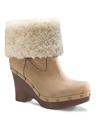 Boho meets moto in these UGG® Australia studded clog booties. Foldover sheepskin cuffs add versatility to the style. Boho meets moto in these UGG® Australia studded clog booties. Foldover sheepskin cuffs add versatility to the style.