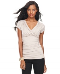 An essential component for any wardrobe, INC's classic surplice top features flattering ruched sides for a feminine, soft look. An essential component for any wardrobe, INC's classic surplice top features flattering ruched sides for a feminine, soft look.