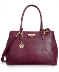 Tap into this season's exotic trend with DKNY lizard-embossed shopper that lends a look of uptown elegance. Dazzling golden hardware and signature accents adorn the exterior, while plenty of pockets offer superb organization within. Tap into this season's exotic trend with DKNY lizard-embossed shopper that lends a look of uptown elegance. Dazzling golden hardware and signature accents adorn the exterior, while plenty of pockets offer superb organization within.