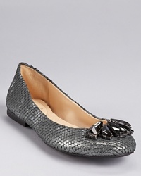 Shimmering snakeskin embossed leather adds sparkling style to a pair of jeweled flats from Enzo Angiolini. Shimmering snakeskin embossed leather adds sparkling style to a pair of jeweled flats from Enzo Angiolini.