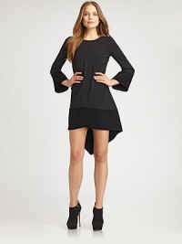 An Italian, fashion-forward frock featuring an asymmetrical, hi-low hem.BoatneckLong sleevesSide zipperA-line silhouetteHi-lo, asymmetrical hemAbout 22 from natural waistPolyesterDry cleanMade in Italy Model shown is 5'9 (175cm) wearing US size 4. An Italian, fashion-forward frock featuring an asymmetrical, hi-low hem.BoatneckLong sleevesSide zipperA-line silhouetteHi-lo, asymmetrical hemAbout 22 from natural waistPolyesterDry cleanMade in Italy Model shown is 5'9 (175cm) wearing US size 4.