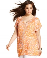 Give your casual wardrobe a kick with INC's short sleeve plus size top, broadcasting a vibrant print! Give your casual wardrobe a kick with INC's short sleeve plus size top, broadcasting a vibrant print!