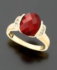 Bold and beautiful. An oval-cut garnet (3-1/2 ct. t.w.) held dear to her heart with round-cut diamonds (1/8 ct. t.w.) at the sides, all set in 14k gold. Bold and beautiful. An oval-cut garnet (3-1/2 ct. t.w.) held dear to her heart with round-cut diamonds (1/8 ct. t.w.) at the sides, all set in 14k gold.