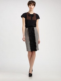 This unique, silky design features a contrast bib and a bowtie appliqué, both finished with pinked edges.Modified point collarAttached bowtie appliquéCap sleevesContrast bibConcealed button frontAbout 24 from shoulder to hem70% viscose/30% woolDry cleanMade in Italy of imported fabricModel shown is 5'10 (177cm) wearing US size 4. This unique, silky design features a contrast bib and a bowtie appliqué, both finished with pinked edges.Modified point collarAttached bowtie appliquéCap sleevesContrast bibConcealed button frontAbout 24 from shoulder to hem70% viscose/30% woolDry cleanMade in Italy of imported fabricModel shown is 5'10 (177cm) wearing US size 4.