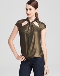 Let this BCBGMAXAZRIA top take you on a gilt trip with its must-have metallic shine. Pair with jeans or black skinny pants, and you're golden. Let this BCBGMAXAZRIA top take you on a gilt trip with its must-have metallic shine. Pair with jeans or black skinny pants, and you're golden.