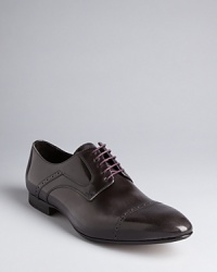 On these ultra-handsome dress shoes, Paul Smith swaps in brogue accents normally reserved for wingtips, culminating in a unique balance of classic refinement and modern design. On these ultra-handsome dress shoes, Paul Smith swaps in brogue accents normally reserved for wingtips, culminating in a unique balance of classic refinement and modern design.