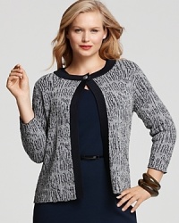 Infuse your look with uptown polish in this Jones New York Collection cardigan, crafted in a textured bouclé knit with solid ribbed trim. Complete the refined look with a chic pencil skirt and a string of pearls. Infuse your look with uptown polish in this Jones New York Collection cardigan, crafted in a textured bouclé knit with solid ribbed trim. Complete the refined look with a chic pencil skirt and a string of pearls.