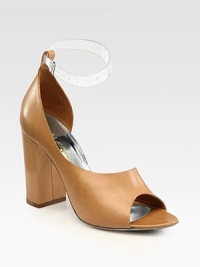 Elegant d'Orsay leather design with two interchangeable ankle straps and a chunky block heel. Self-covered heel, 4 (100mm)Leather and PVC upperLeather lining and solePadded insoleImportedPlease note: This style includes nude and clear interchangeable ankle strapsOUR FIT MODEL RECOMMENDS ordering one half size up as this style runs small. Elegant d'Orsay leather design with two interchangeable ankle straps and a chunky block heel. Self-covered heel, 4 (100mm)Leather and PVC upperLeather lining and solePadded insoleImportedPlease note: This style includes nude and clear interchangeable ankle strapsOUR FIT MODEL RECOMMENDS ordering one half size up as this style runs small.