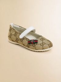 The familiar GG woven fabric in a graceful ballerina flat with sophisticated Gucci touches.Fabric upperGrip-tape close strapRubber soleSignature striped bow detailMade in Italy The familiar GG woven fabric in a graceful ballerina flat with sophisticated Gucci touches.Fabric upperGrip-tape close strapRubber soleSignature striped bow detailMade in Italy
