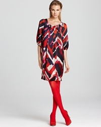 Boast fashion-forward spirit in a free flowing Armani Collezioni silk dress. The loose silhouette is fall-ready with bright tights and coordinating pumps, plus the requisite baubles and bangles. Boast fashion-forward spirit in a free flowing Armani Collezioni silk dress. The loose silhouette is fall-ready with bright tights and coordinating pumps, plus the requisite baubles and bangles.
