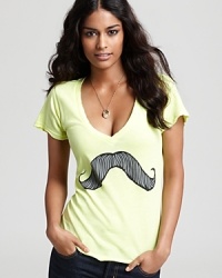 A mustache graphic makes a tongue-in-cheek statement on this WILDFOX tee for lighthearted weekend style. A mustache graphic makes a tongue-in-cheek statement on this WILDFOX tee for lighthearted weekend style.