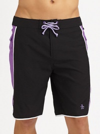 Modern, quick-dry trunks for the beach, board and beyond with pieced construction and comfortable knee length. Drawstring waistBack flap pocketsMesh liningInseam, about 9½PolyesterMachine washImported Modern, quick-dry trunks for the beach, board and beyond with pieced construction and comfortable knee length. Drawstring waistBack flap pocketsMesh liningInseam, about 9½PolyesterMachine washImported