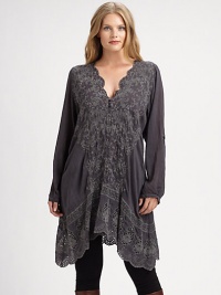 Elegant embroidery and a feminine scalloped neckline come together to create a tunic you will not want to take off.Scalloped necklineLong sleevesEmbroidered detailsHandkerchief hemAbout 38 from shoulder to hemRayonMachine washImported Elegant embroidery and a feminine scalloped neckline come together to create a tunic you will not want to take off.Scalloped necklineLong sleevesEmbroidered detailsHandkerchief hemAbout 38 from shoulder to hemRayonMachine washImported