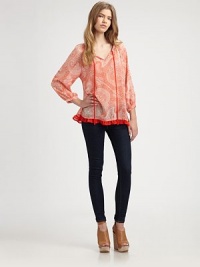 Airy, paisley-printed v-neck with bishop sleeves and a darling ruffled hem. V-neck with front tiesLong bishop sleevesRuffled cropped back hemPolyesterMachine washImportedModel shown is 5'9½ (176cm) wearing US size Small. Airy, paisley-printed v-neck with bishop sleeves and a darling ruffled hem. V-neck with front tiesLong bishop sleevesRuffled cropped back hemPolyesterMachine washImportedModel shown is 5'9½ (176cm) wearing US size Small.