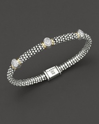 From the Twilight collection, thin caviar rope bracelet with three oval diamond pavé stations and gold accents. Designed by Lagos. From the Twilight collection, thin caviar rope bracelet with three oval diamond pavé stations and gold accents. Designed by Lagos.