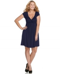 Ruching and gathering lend an ultra-flattering silhouette to the short sleeve plus size dress by Soprano-- it's a must-have! Ruching and gathering lend an ultra-flattering silhouette to the short sleeve plus size dress by Soprano-- it's a must-have!