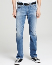 Distressed and heavily faded for maximum authenticity, these jeans will be your favorite pair from day one, cut with a straight leg and featuring signature True Religion horseshoe stitching on the front small pocket and back pockets. Distressed and heavily faded for maximum authenticity, these jeans will be your favorite pair from day one, cut with a straight leg and featuring signature True Religion horseshoe stitching on the front small pocket and back pockets.