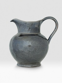 A unique mottling technique lends a hand-thumbed, hammered design to a beautiful metallic pewter pitcher with the look of an old-world favorite. 2.2-quart capacity 8 high Dishwasher safe Imported A unique mottling technique lends a hand-thumbed, hammered design to a beautiful metallic pewter pitcher with the look of an old-world favorite. 2.2-quart capacity 8 high Dishwasher safe Imported