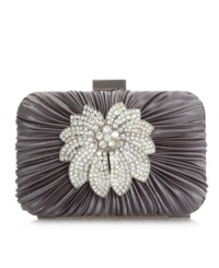 An elegant accessory for a night on the town. With ruched satin and an oversized rhinestone flower embellishment, This Jessica McClintock design will beautifully compliment your night-out ensemble. An elegant accessory for a night on the town. With ruched satin and an oversized rhinestone flower embellishment, This Jessica McClintock design will beautifully compliment your night-out ensemble.