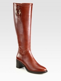 Impeccable craftsmanship defines this tall equestrian-inspired silhouette of rich leather with a goldtone buckle. Rubber heel, 2½ (65mm)Shaft, 15½Leg circumference, 14¾Leather upperPull-on styleLeather liningRubber solePadded insoleMade in Italy Impeccable craftsmanship defines this tall equestrian-inspired silhouette of rich leather with a goldtone buckle. Rubber heel, 2½ (65mm)Shaft, 15½Leg circumference, 14¾Leather upperPull-on styleLeather liningRubber solePadded insoleMade in Italy