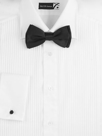 EXCLUSIVELY OURS. For this elegant tuxedo shirt, we turned to Italy's long tradition of expert craftsmanship and tailoring. The result? A classic-fitting new standard in pleated cotton. Buttonfront Point collar Pleated front French cuffs with knot detail Cotton Machine wash Made in Italy 