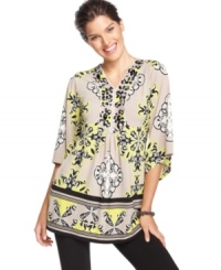 Rhinestones add a dressy appeal to this boldly printed Alfani tunic -- perfect over leggings or skinny jeans! Rhinestones add a dressy appeal to this boldly printed Alfani tunic -- perfect over leggings or skinny jeans!