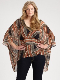 An invigorating print meets a woven silk silhouette, complemented by a beautifully beaded neckline. Beaded necklineKimono sleevesAllover printAbout 26 from shoulder to hemSilkDry cleanImported An invigorating print meets a woven silk silhouette, complemented by a beautifully beaded neckline. Beaded necklineKimono sleevesAllover printAbout 26 from shoulder to hemSilkDry cleanImported