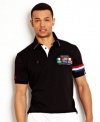Take your style international with this polo shirt from Nautica with country embroidery.