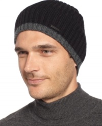 Calvin Klein tips this hat with charcoal, adding a modernist edge to the basic beanie. Calvin Klein tips this hat with charcoal, adding a modernist edge to the basic beanie.